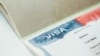 Shutterstock - American visa in passport blanked out. Close up of passport with US visa